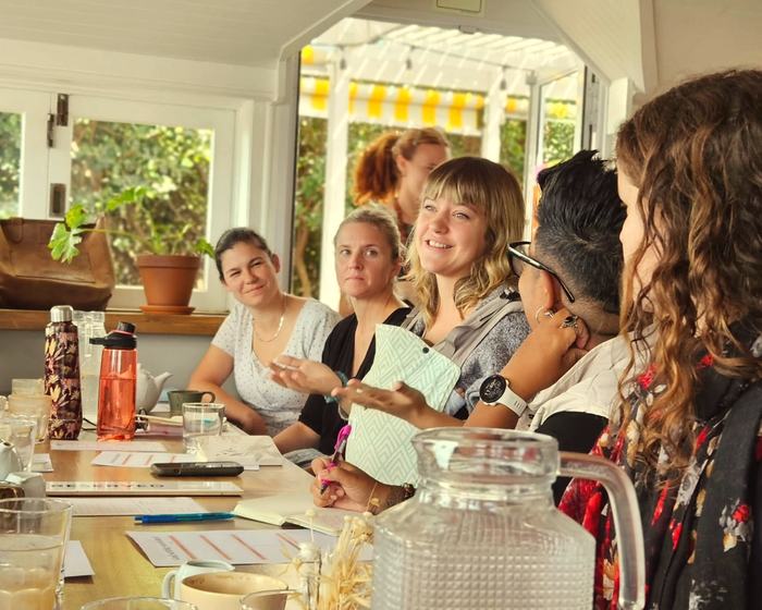 A member sharing her story while her pod listens