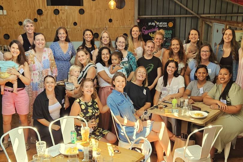 A full room of Boss Moms members and their little ones