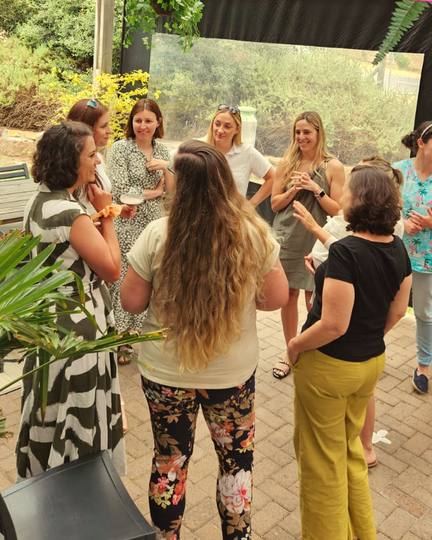 Members chatting on a patio at a meetup